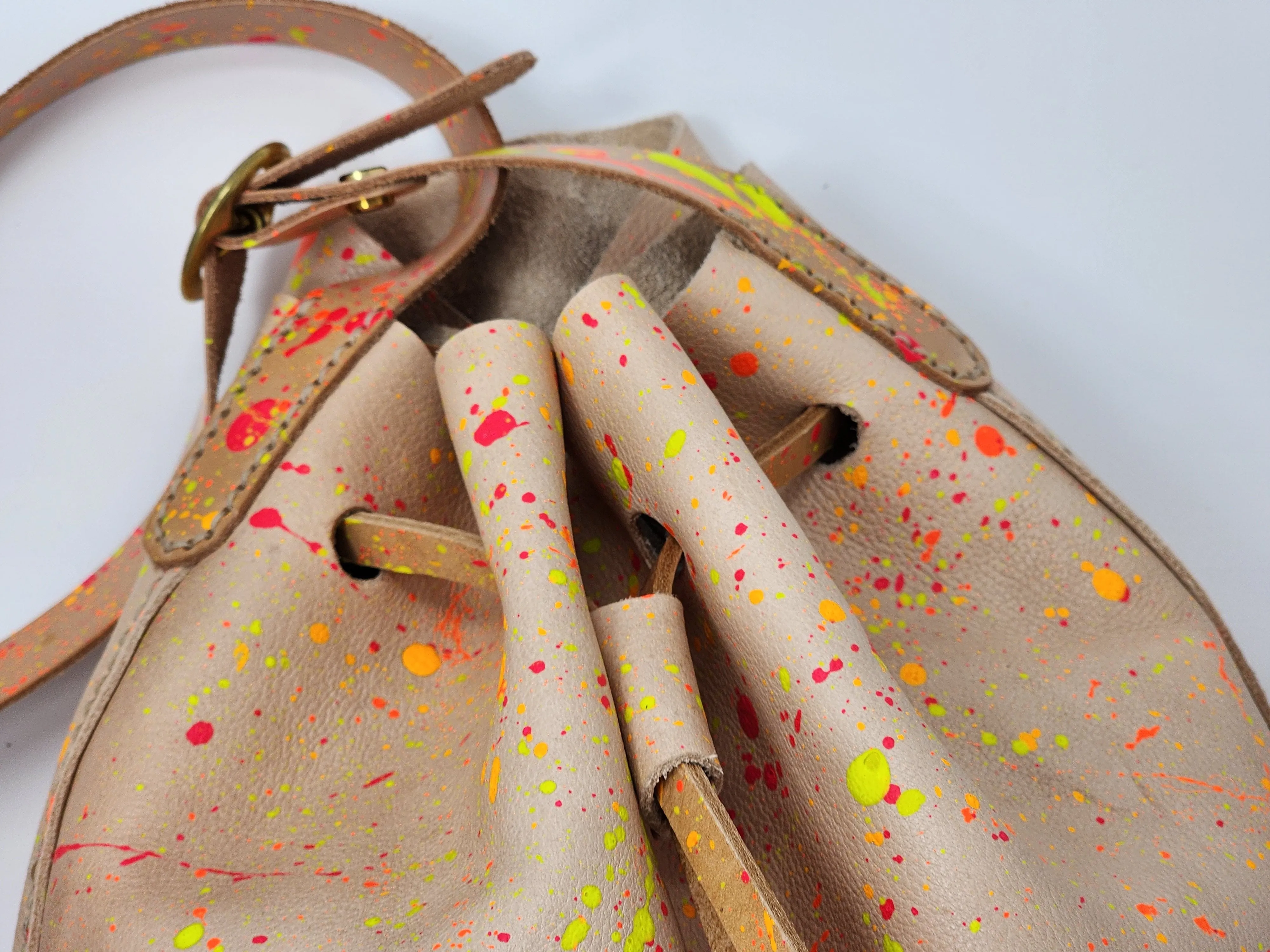 Neon Splatter Veg Tan Leather Drawstring Crossbody Bucket Bag