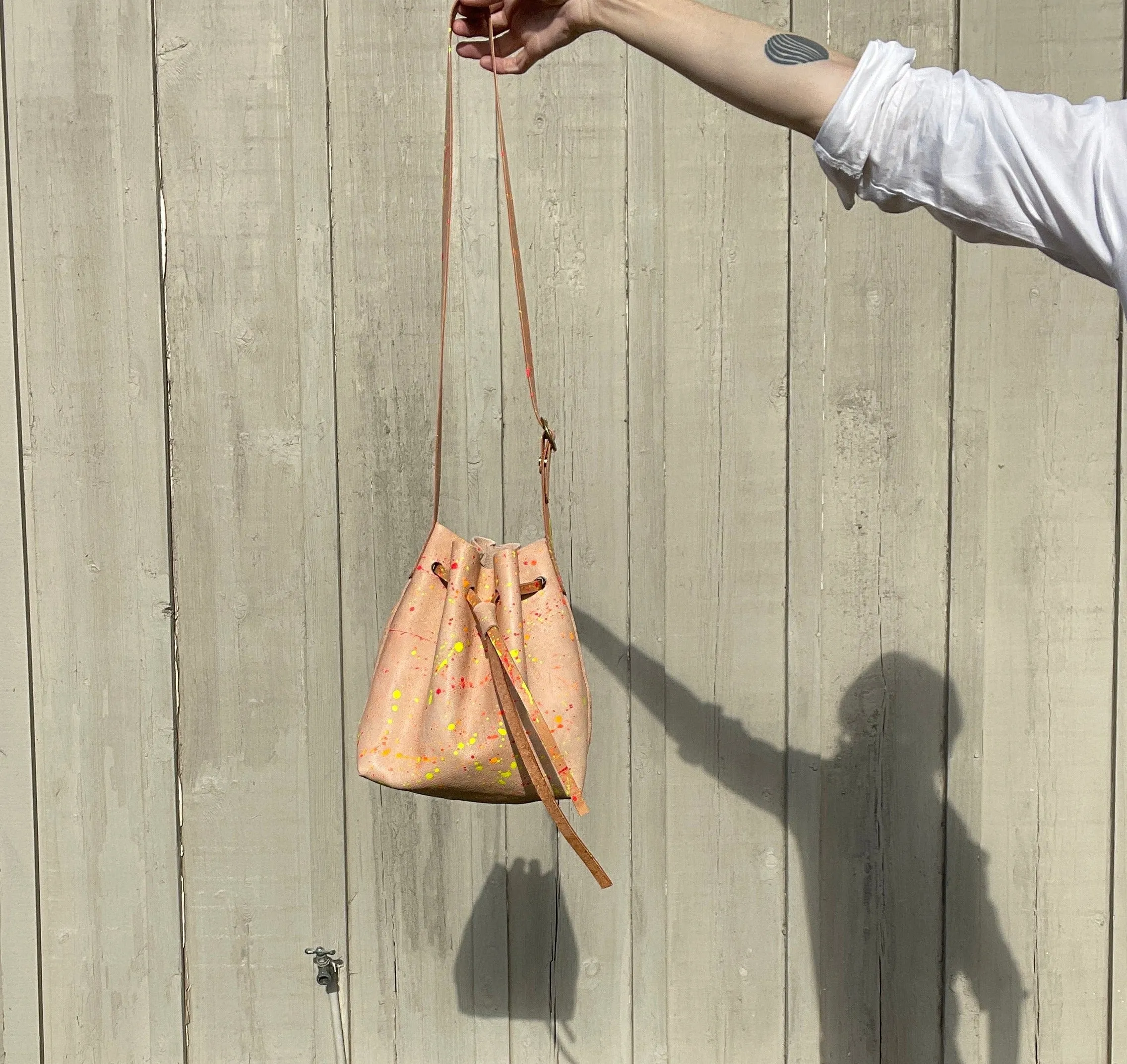 Neon Splatter Veg Tan Leather Drawstring Crossbody Bucket Bag